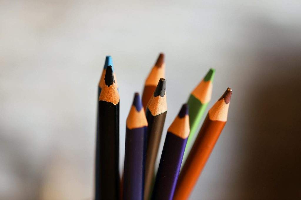 Vibrant close-up of colored pencils showcasing a variety of hues, perfect for creative projects.