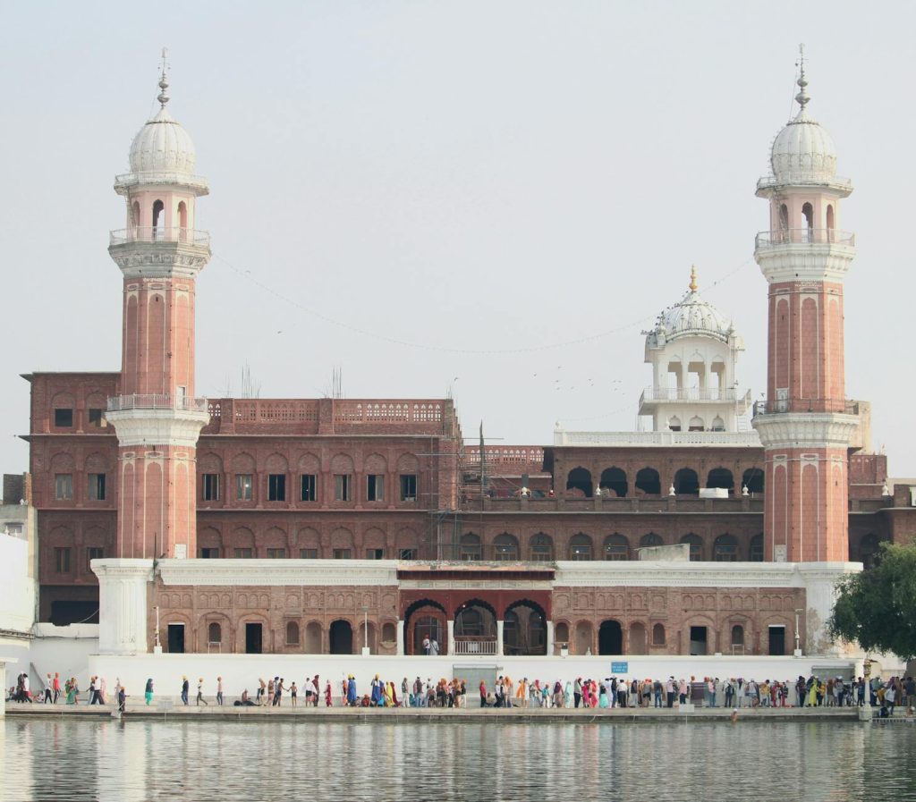 Ramgarhia Bunga in Amritsar, Punjab, India, showcasing stunning Mughal architecture with visitors.