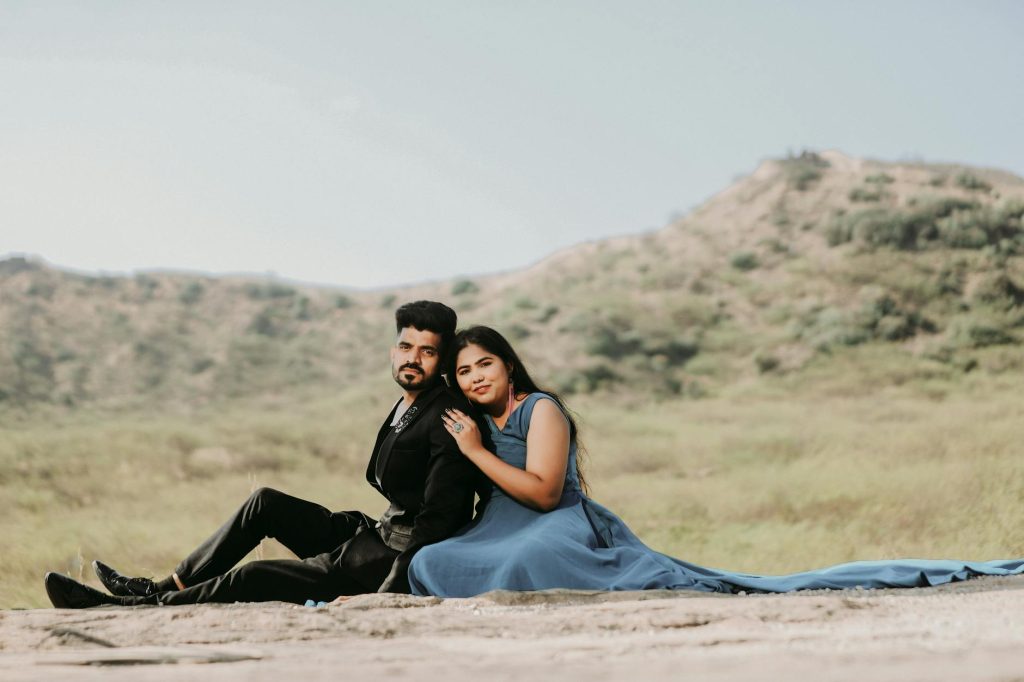 A romantic pre-wedding photo of a couple in a desert landscape of Bhuj, India.