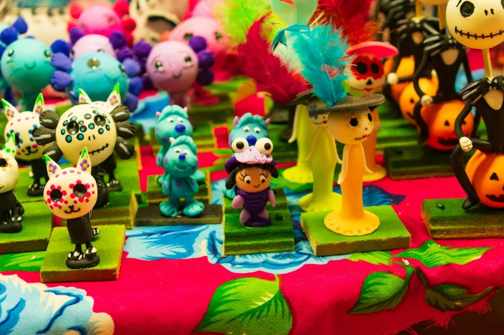 Vibrant handcrafted Day of the Dead figurines displayed in Toluca de Lerdo, Mexico.
