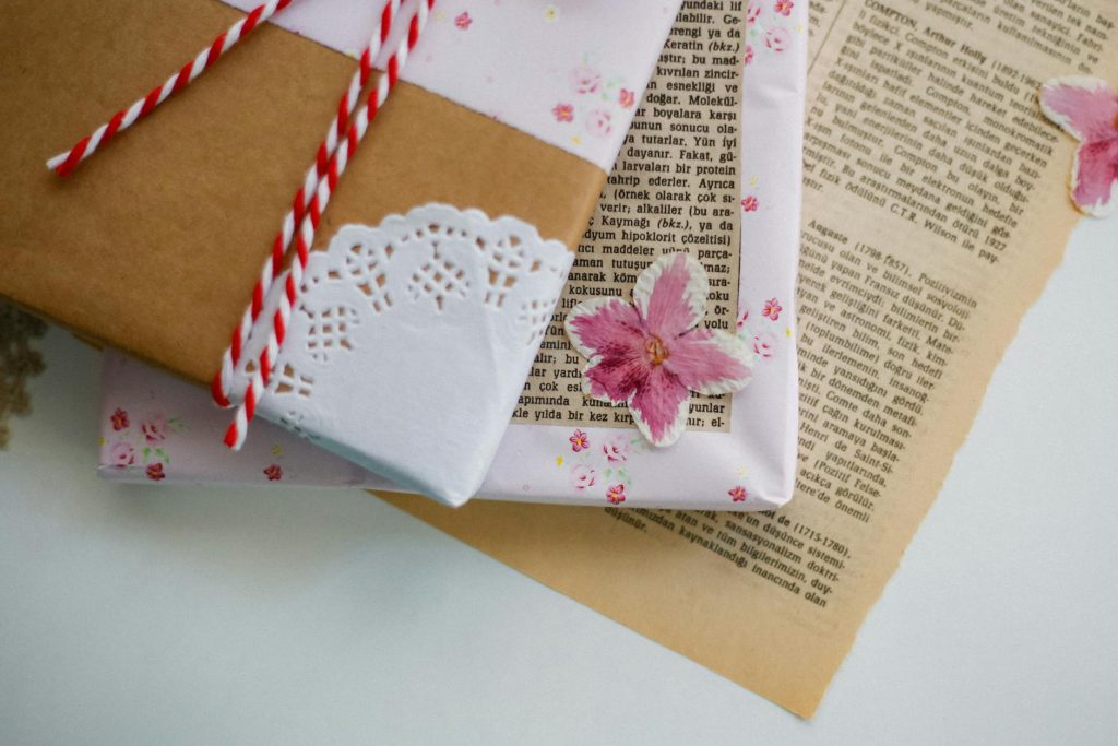 Elegant gift wrapping with floral designs on paper, perfect for special occasions.