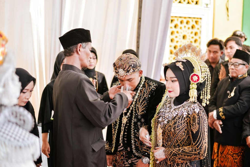 Intricate Javanese wedding ceremony showcasing traditional attire and customs.